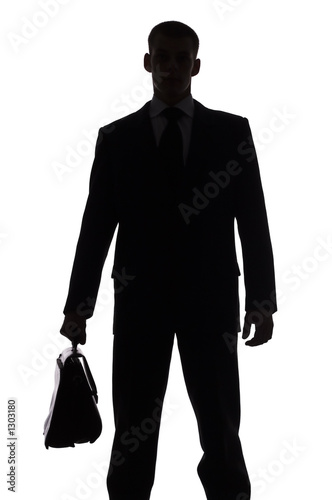 silhouette of man with suitcase