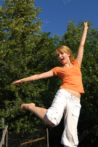 girl jumping on trampoline