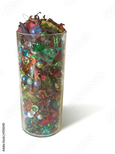vase with multicolored balls and frog