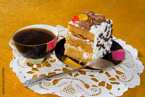 cup of coffee and slice of creamy cake photo