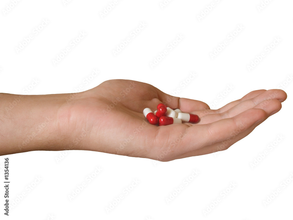 hand with pills hand with pills
