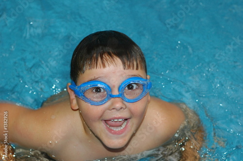 boy laughing in the swimming pool © Tony