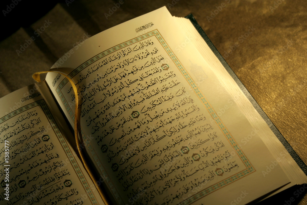 Fototapeta premium open book pages of holy koran