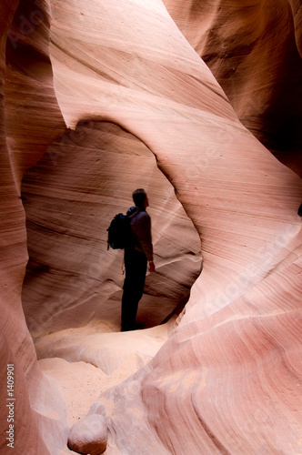 hiker in slot canyon photo