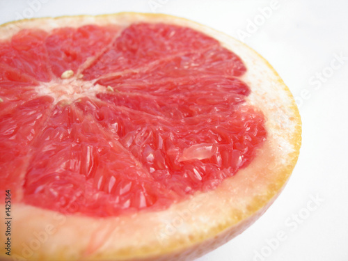 slice of grapefruit on a white background