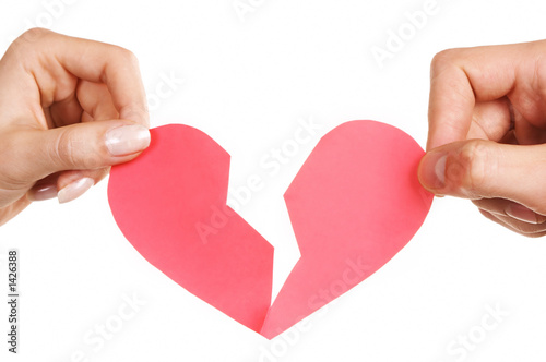 man woman hands holding broken heart