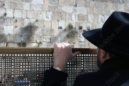 man looking at the western wall, jerusalem israel