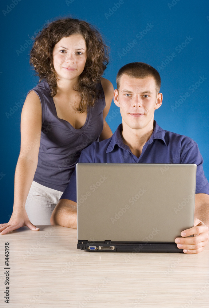 young couple at the table with laptop