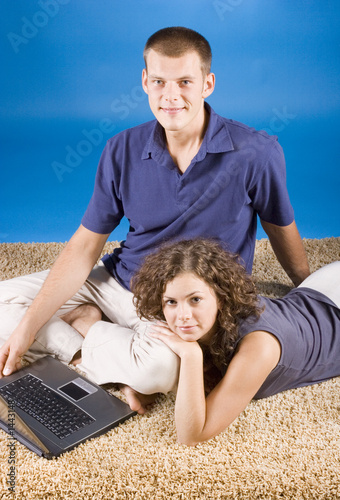 young couple on beige carpet