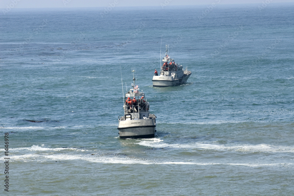 two coast guard boats in rescue operation