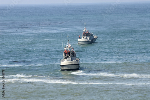 two coast guard boats in rescue operation