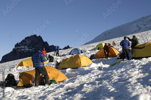 mountain climbers and their tents