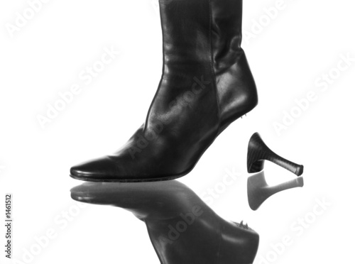 elegant black leather boot with a broken high heel