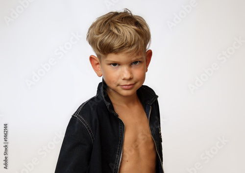 young boy, looking at a camera