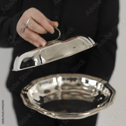 woman showing a silver plate