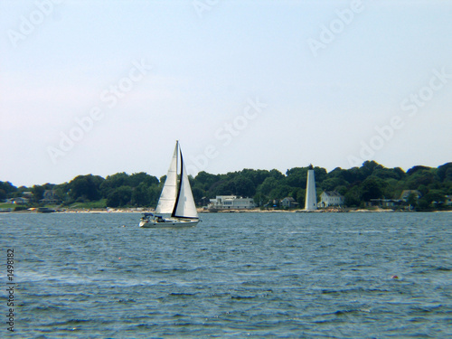 new london lighthouse and sailboat