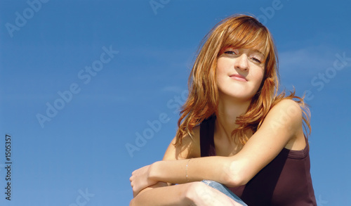 young girl against blue sky