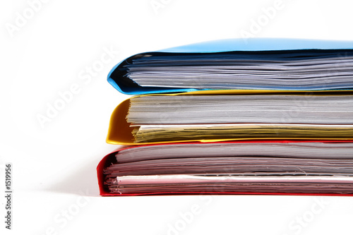 stack of colorful binders in a office