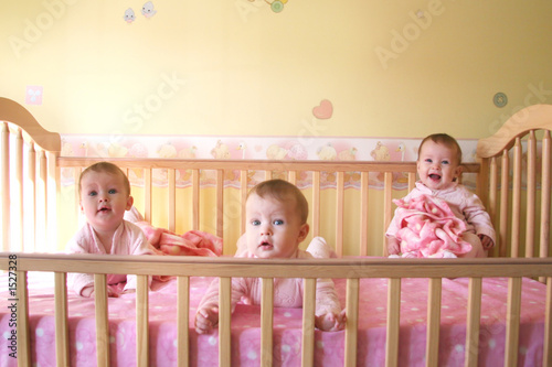 baby girls in crib - triplets