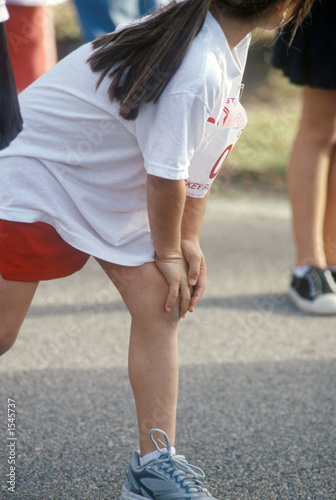 young woman getting ready to race