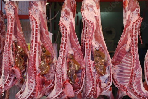 lamb carcases in the butcher's stall