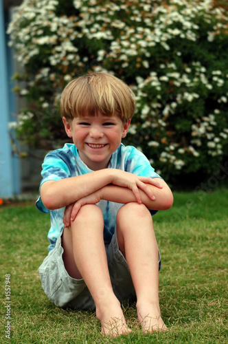 boy sitting in grass