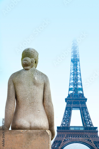 woman statue and eiffel tower photo