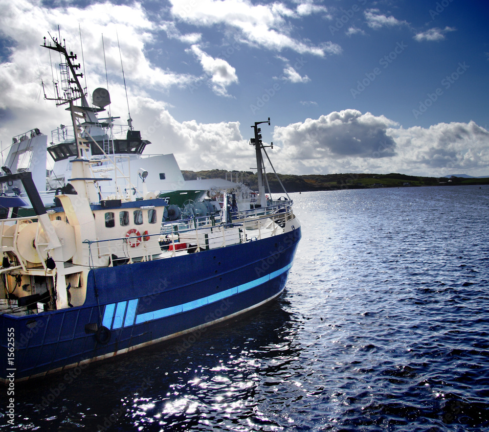 fishing boat moored in a harbour fishing boat moored in a harbour