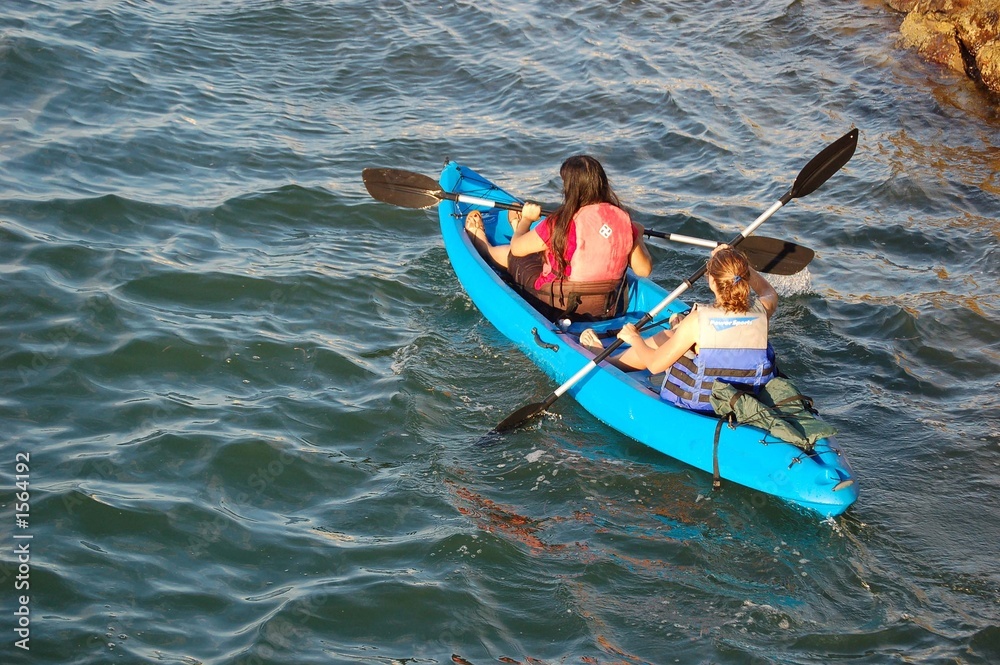 Fototapeta premium girls in a blue kayak