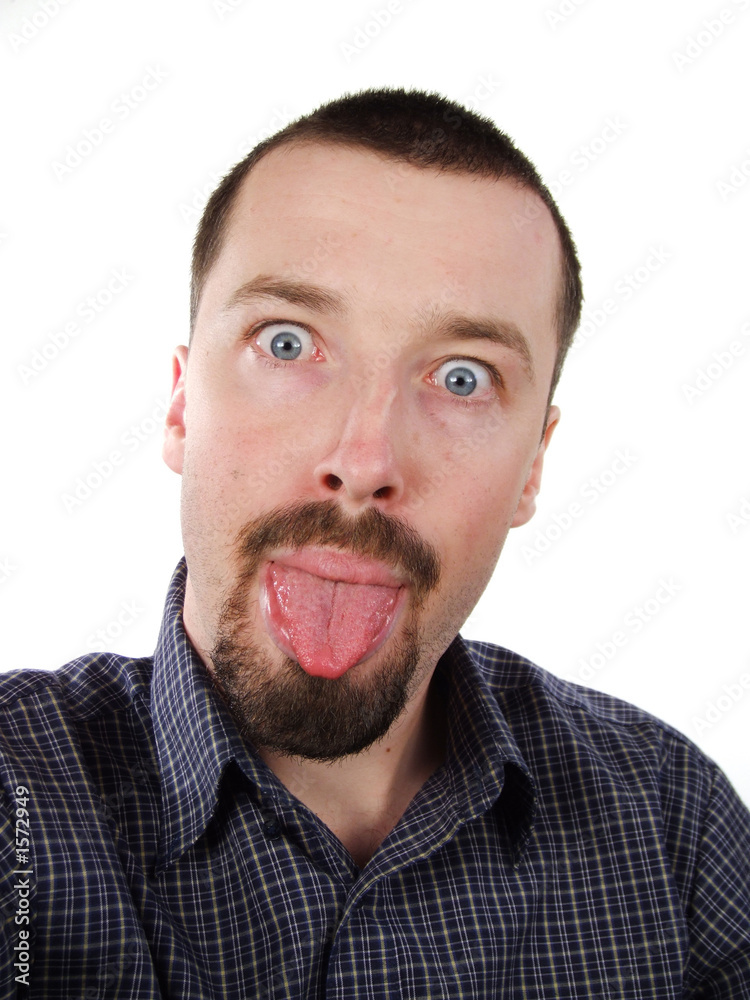 young adult poking his tongue out