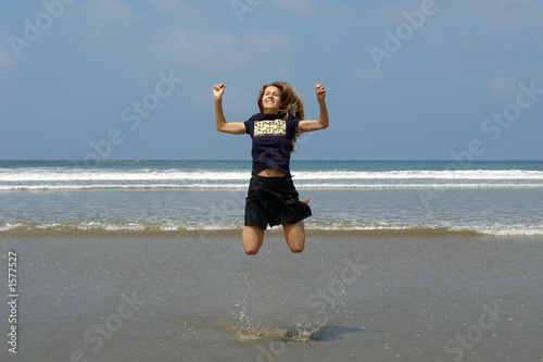 jumping girl on the beach