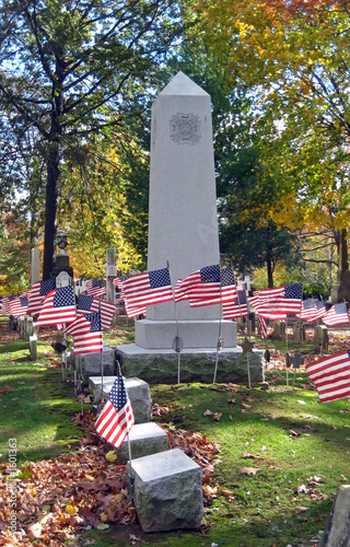 cemetery monument with flags photo