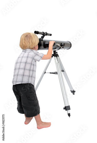 young child or boy looking through a telescope