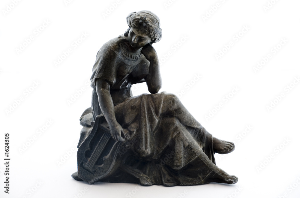 antique metal statue on white background