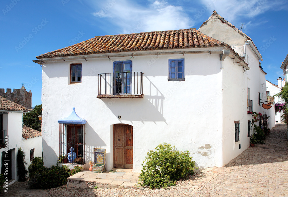narrow, cobbled streets and houses of spanish pueblo narrow, cobbled streets and houses of spanish pueblo