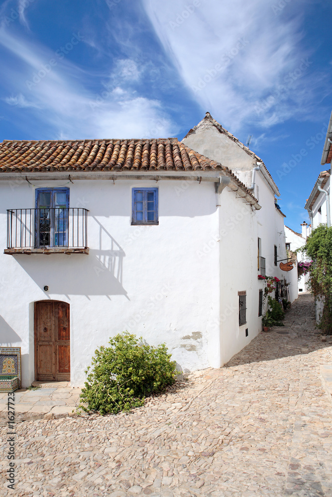 narrow, cobbled streets and houses of spanish pueblo
