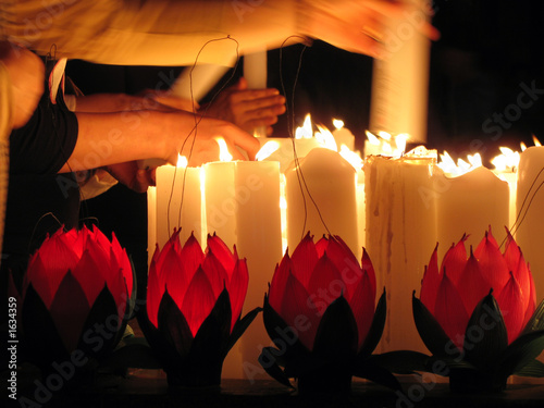 lighting candles on buddha's birthday