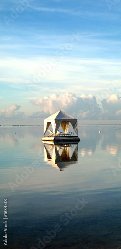 floating tent with lounge chairs