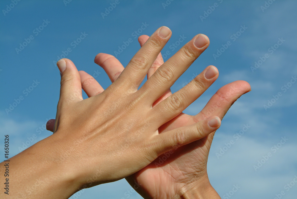 hands in hands against sky, friendship concept hands in hands against sky, friendship concept
