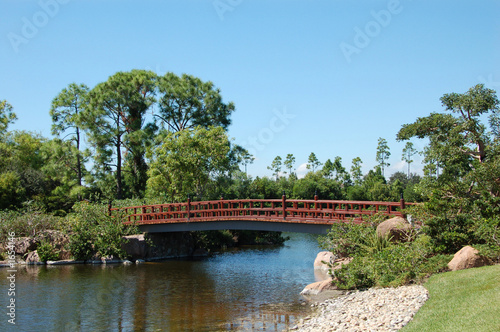 japanese garden with lake and bridge