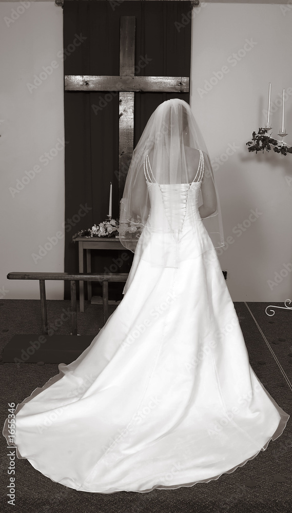 bride at alter with cross