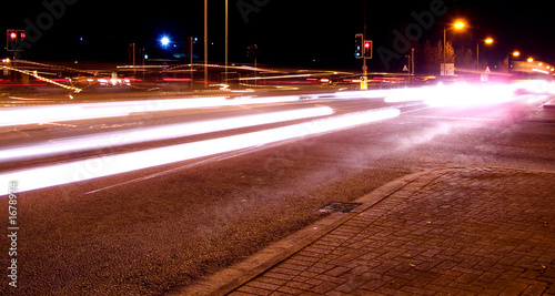 night speeding traffic at crossing photo