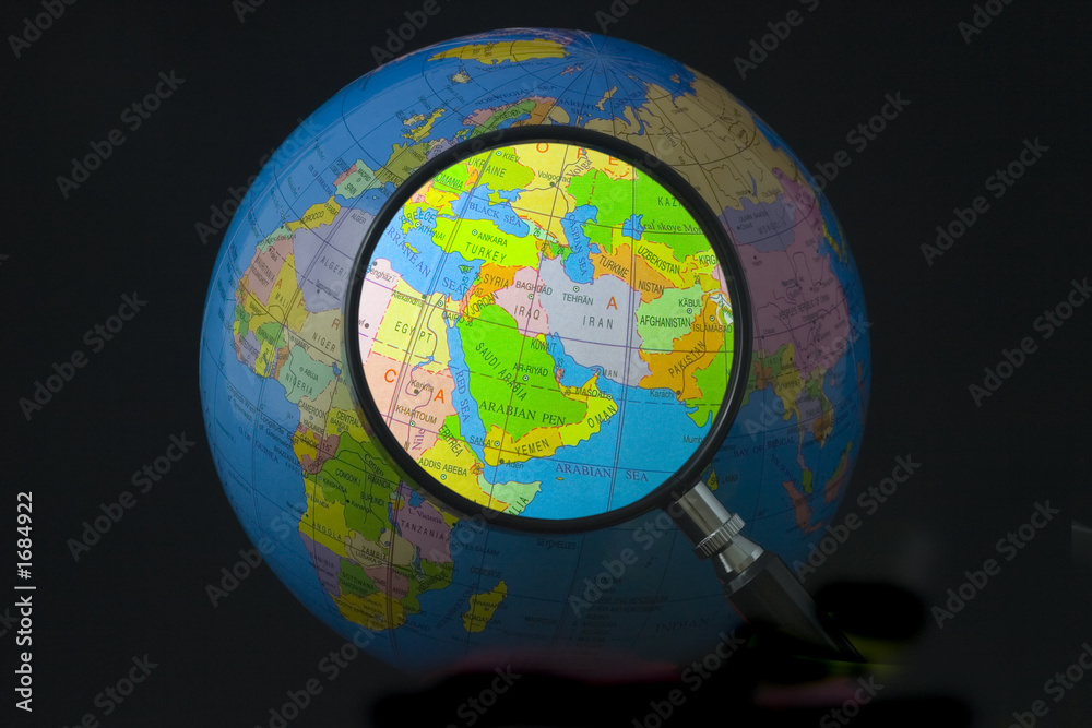 Naklejka premium Map of middle east on globe seen through magnifying glass