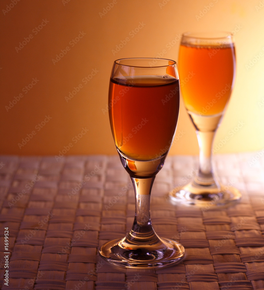Obraz premium golden alcohol glasses