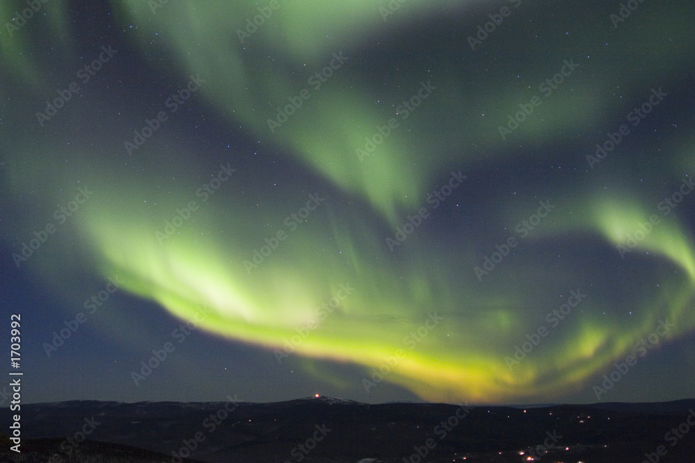 rapidly growing arc of aurora borealis