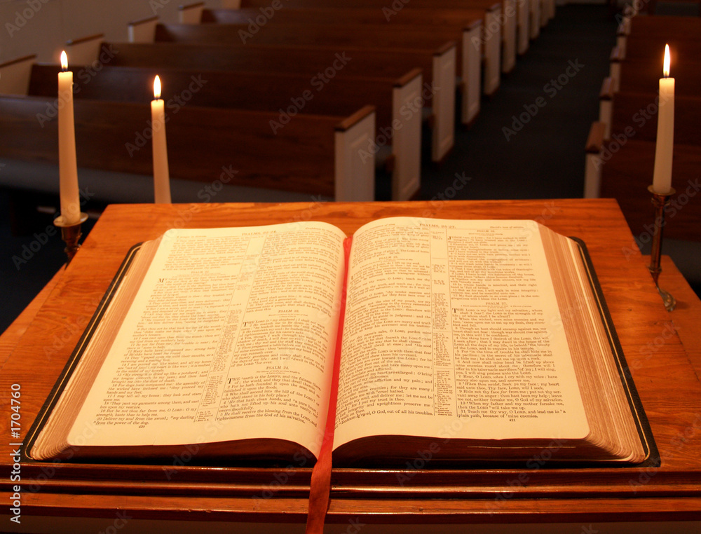 Fototapeta premium bible on pulpit with candles