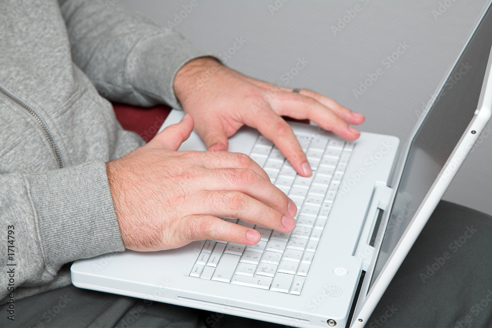 hands of a man on laptop keyboard hands of a man on laptop keyboard