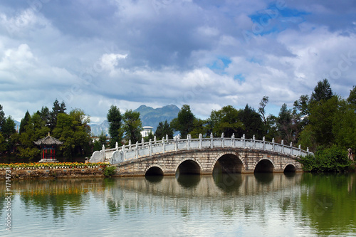 a stone bridge in lijiang city