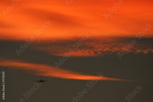 plane into sunset