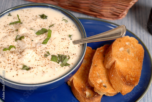 overhead view of new england clam chowder in a blue bowl photo